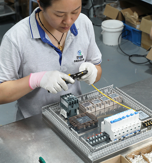 worker operating hot melt glue machine